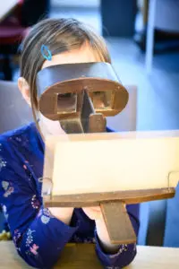 Child looking at stereoscopes