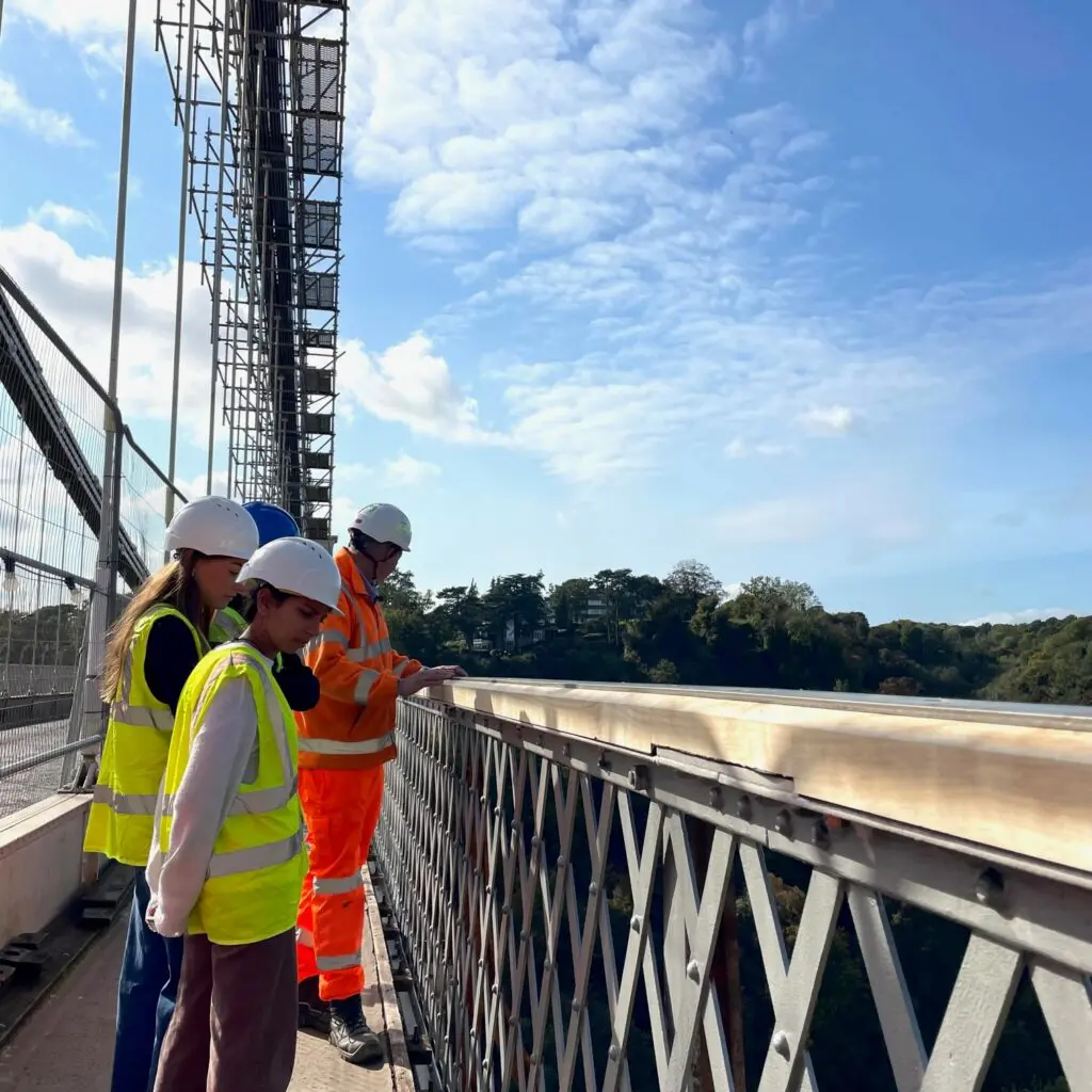 Students inspect the parapet fence