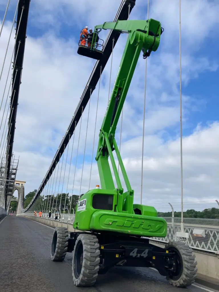 Cherry picker mobile platform on bridge deck