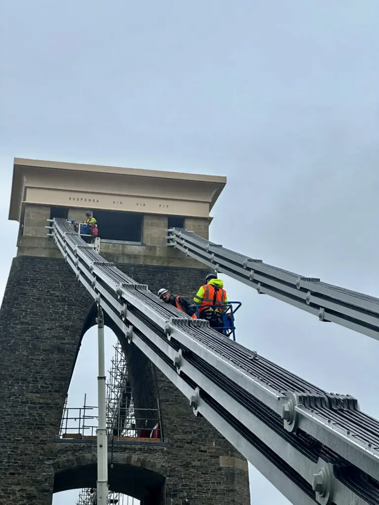 Workers reinstall the latchway from a platform lift