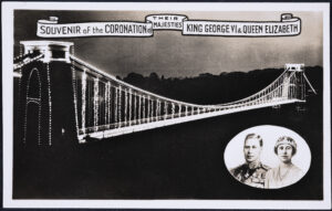 Image of black and white postcard showing illumination of bridge for Coronation of